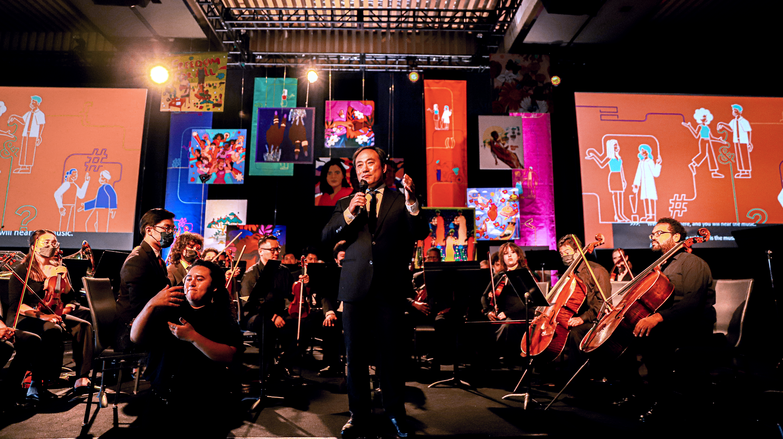 Orchestral Performance at the event with illustrations in background