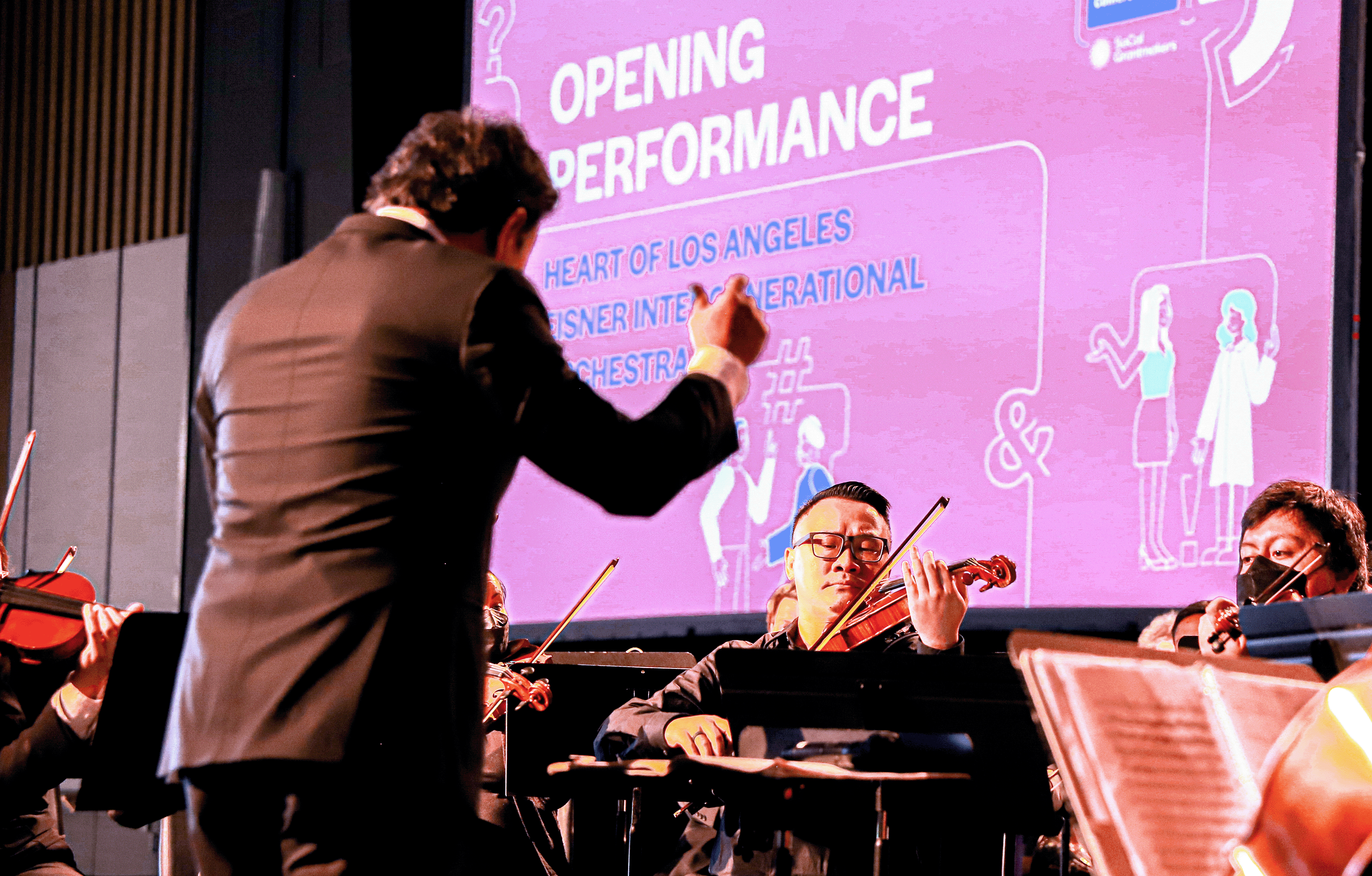 Orchestral Performance at the event with illustrations in background